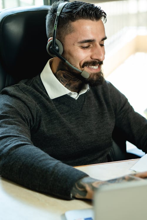 Free Cheerful Man Working in a Call Center Stock Photo