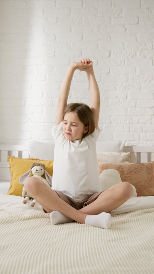 Girl Stretching her Body after Sleep