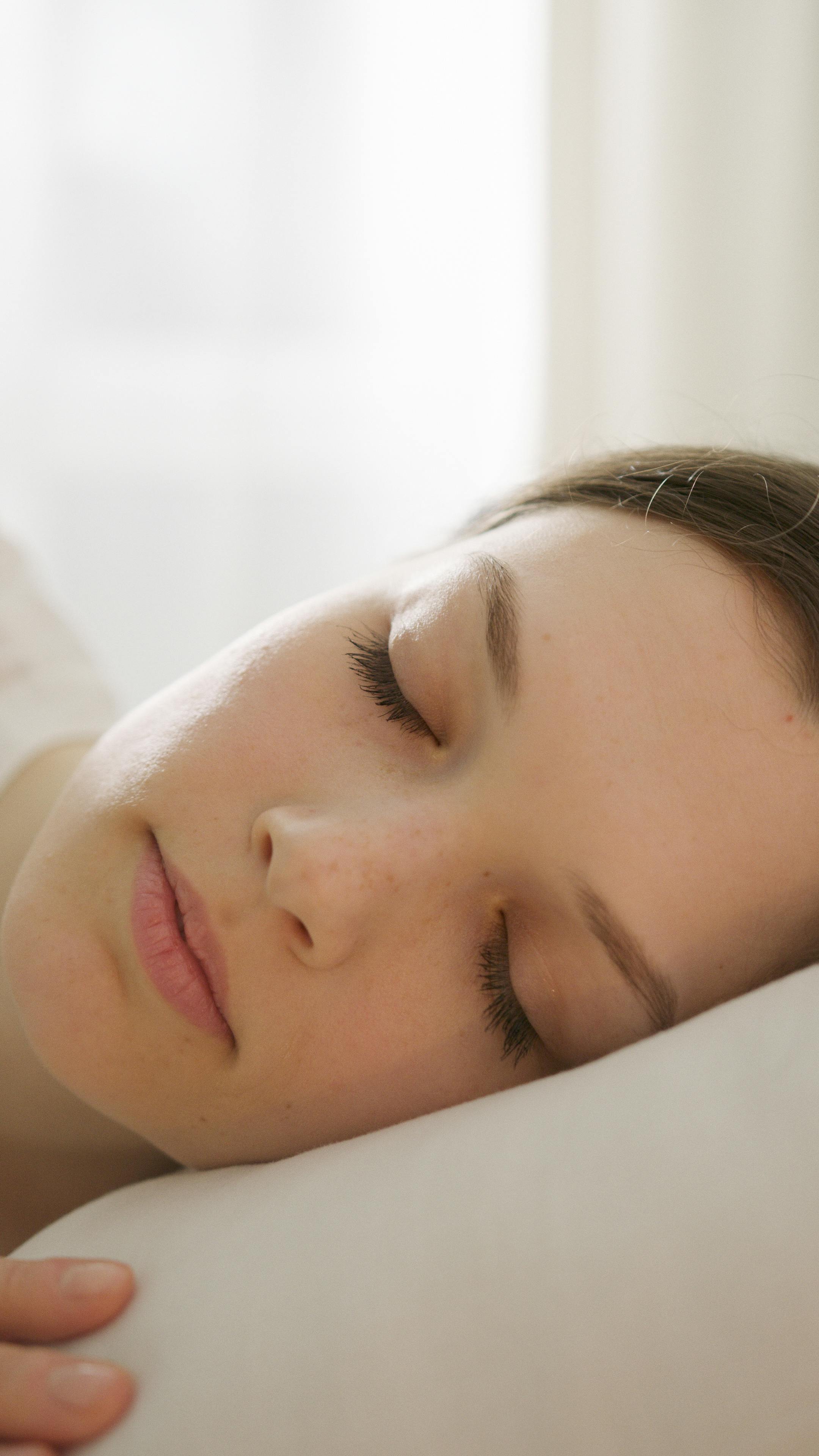 Woman sleeping peacefully beauty sleep routine for glowing skin