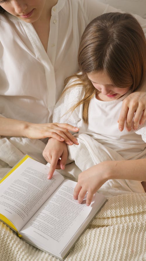 Mother and Daughter Reading a Book Together