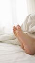 Person Lying on White Bed