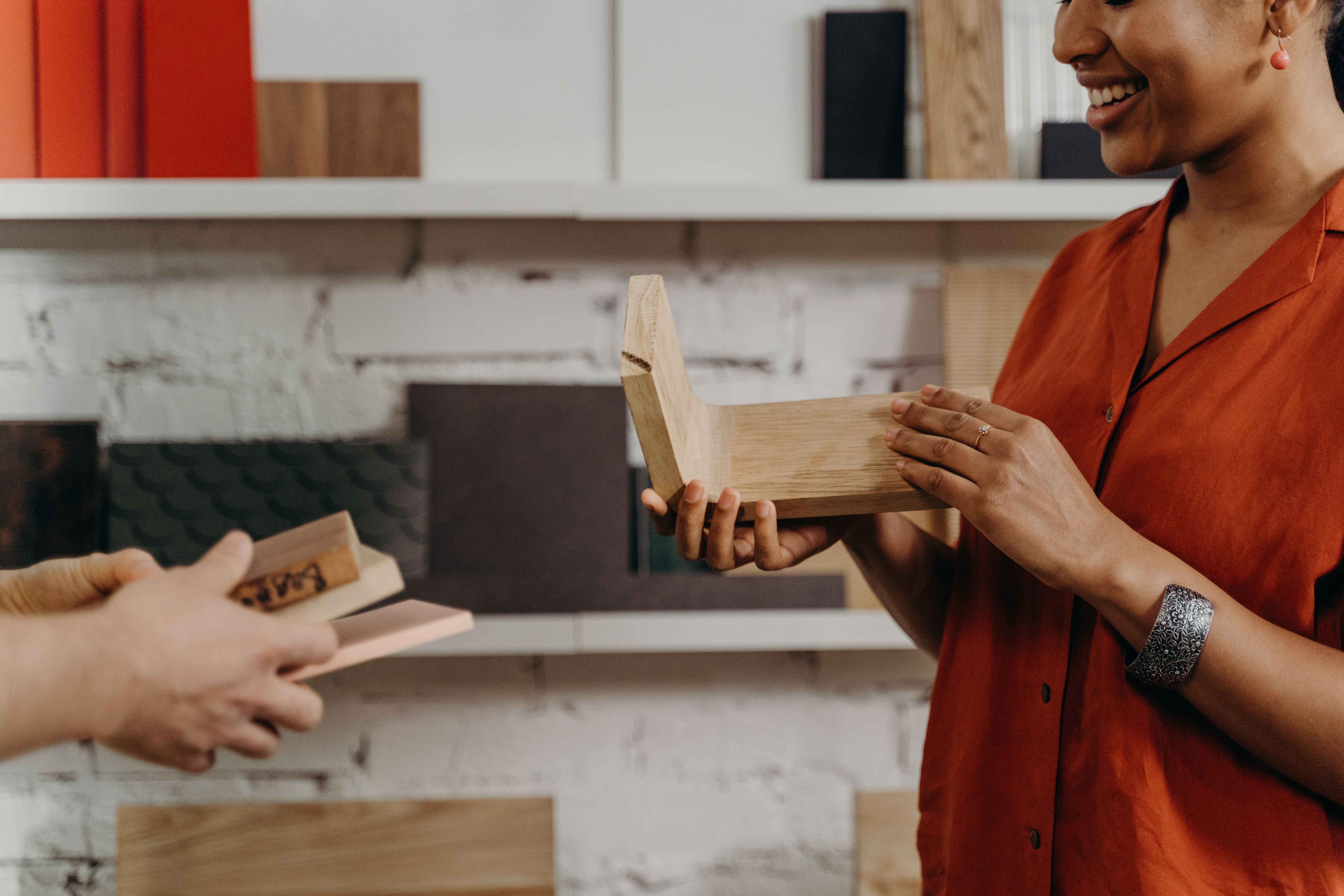 Wood samples held up to check a stain match