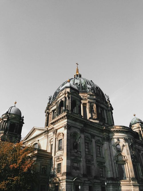 Free Low angle view of Berlin Cathedral's historic dome against a gray sky. Stock Photo