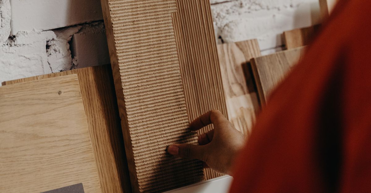 Development Build Material Samples Construction Material Samples Displayed on a Brick Wall · Free Stock Photo