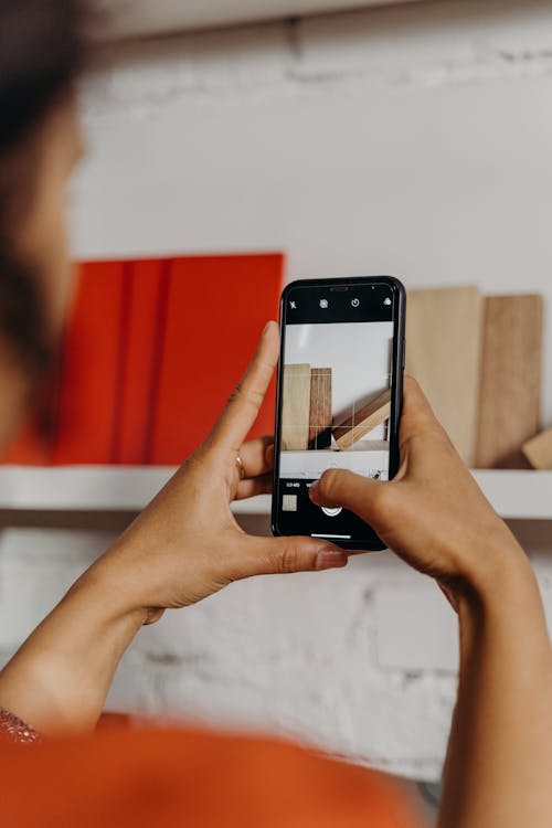 Free Close-Up Shot of a Person Taking Photo Using a Smartphone Stock Photo