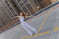 A Woman Dancing on the Parking Lot