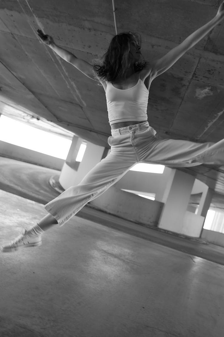 A Woman Dancing In The Parking Lot