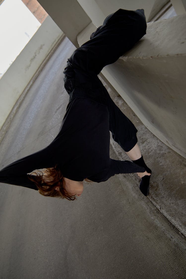 Flexible Woman Dancing At A Car Park