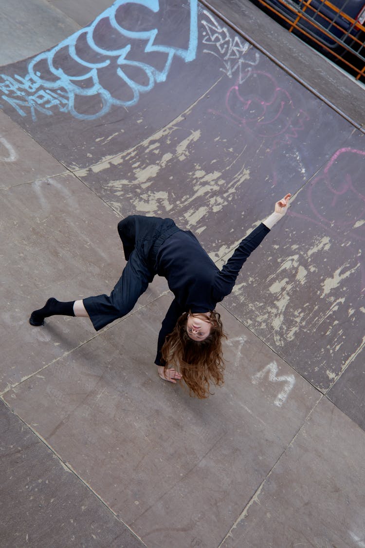 Flexible Woman Dancing On A Ramp