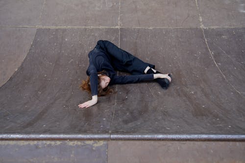 Flexible Woman Lying on a Ramp