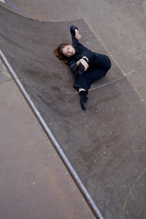 Flexible Woman Lying on a Ramp