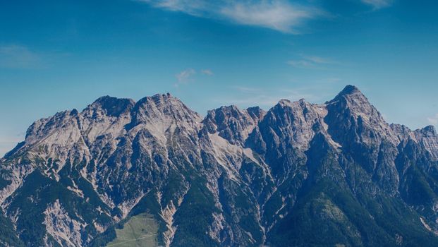 Stunning view of the majestic Alps under a clear blue sky near Salzburg, Austria.