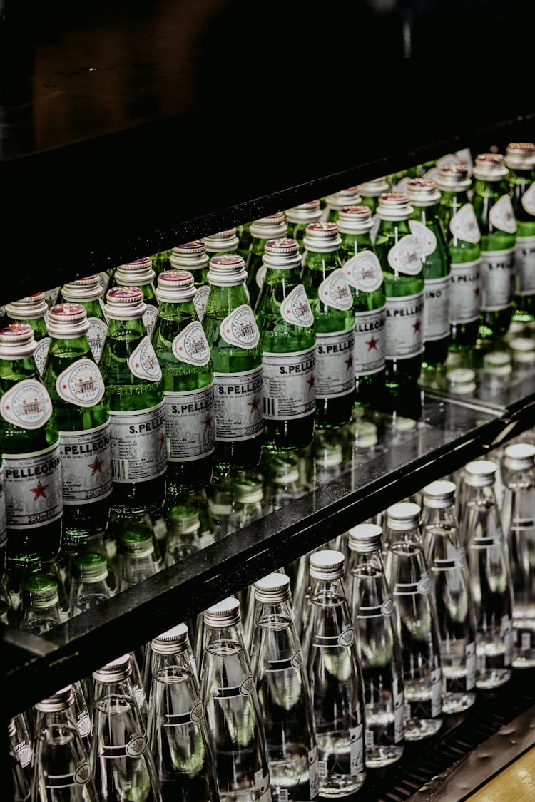 Green Glass Bottles On The Shelves