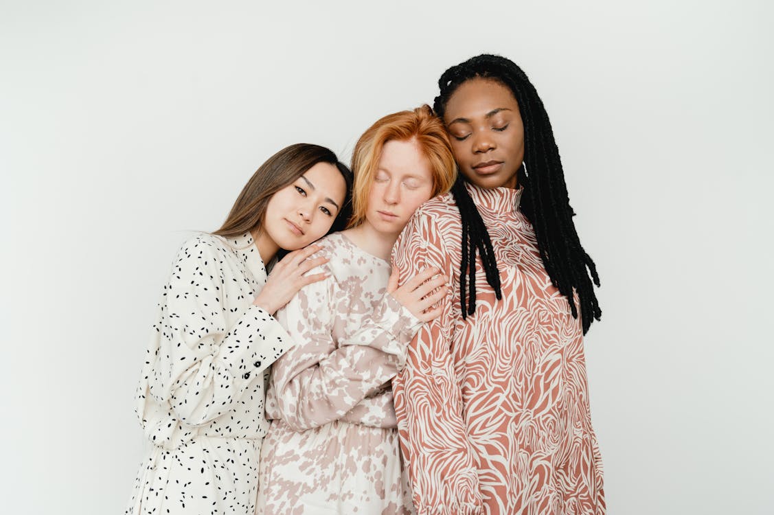 3 Women in White and Brown Floral Long Sleeve Dress