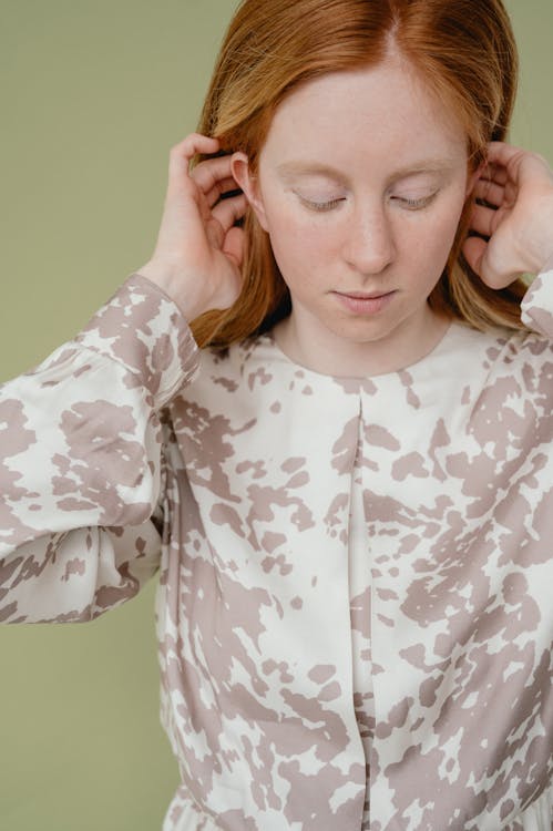 Woman in White and Black Floral Long Sleeve Shirt