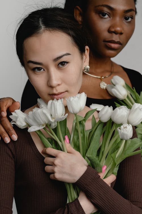 Portrait of Two Women with Flowers