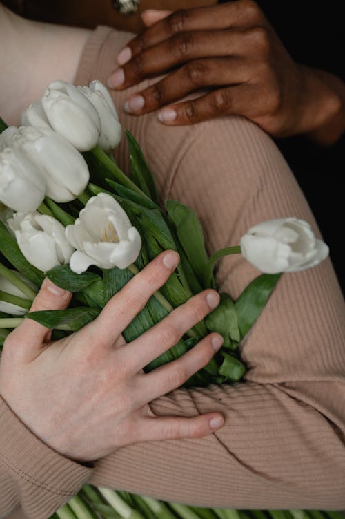 Close up of a Woman Holding Flowers