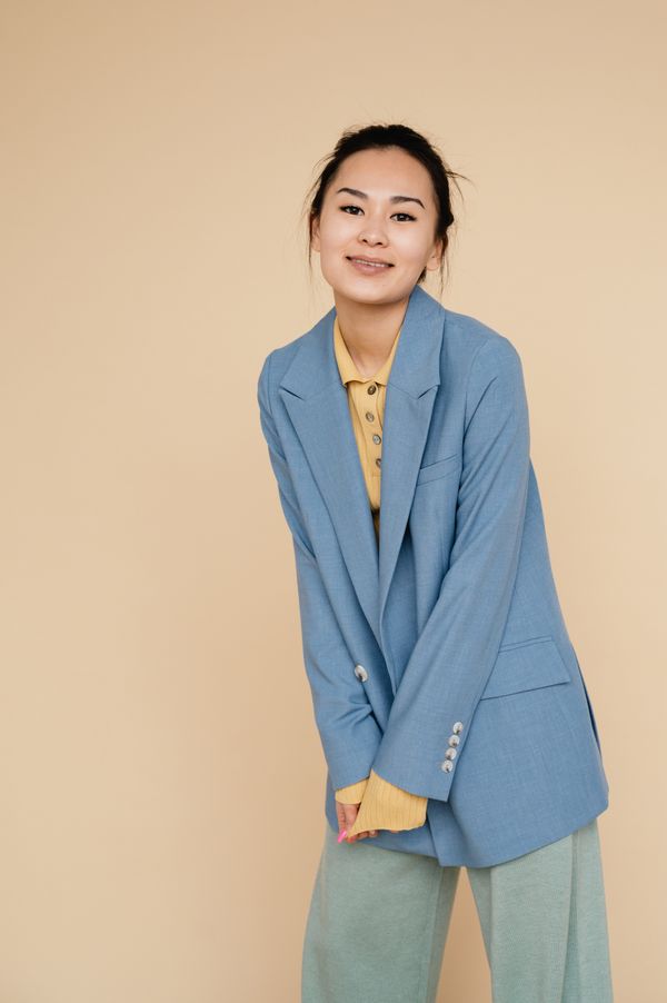 Woman in a cardigan-blazer hybrid smart casual outfit