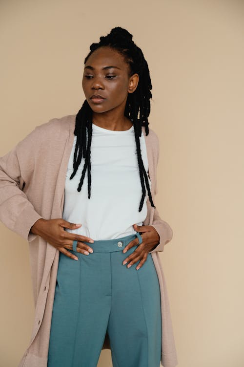 Woman with Braided Hair Wearing a Cardigan and Pants