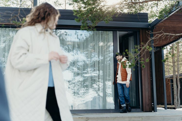 Couple Outside A House