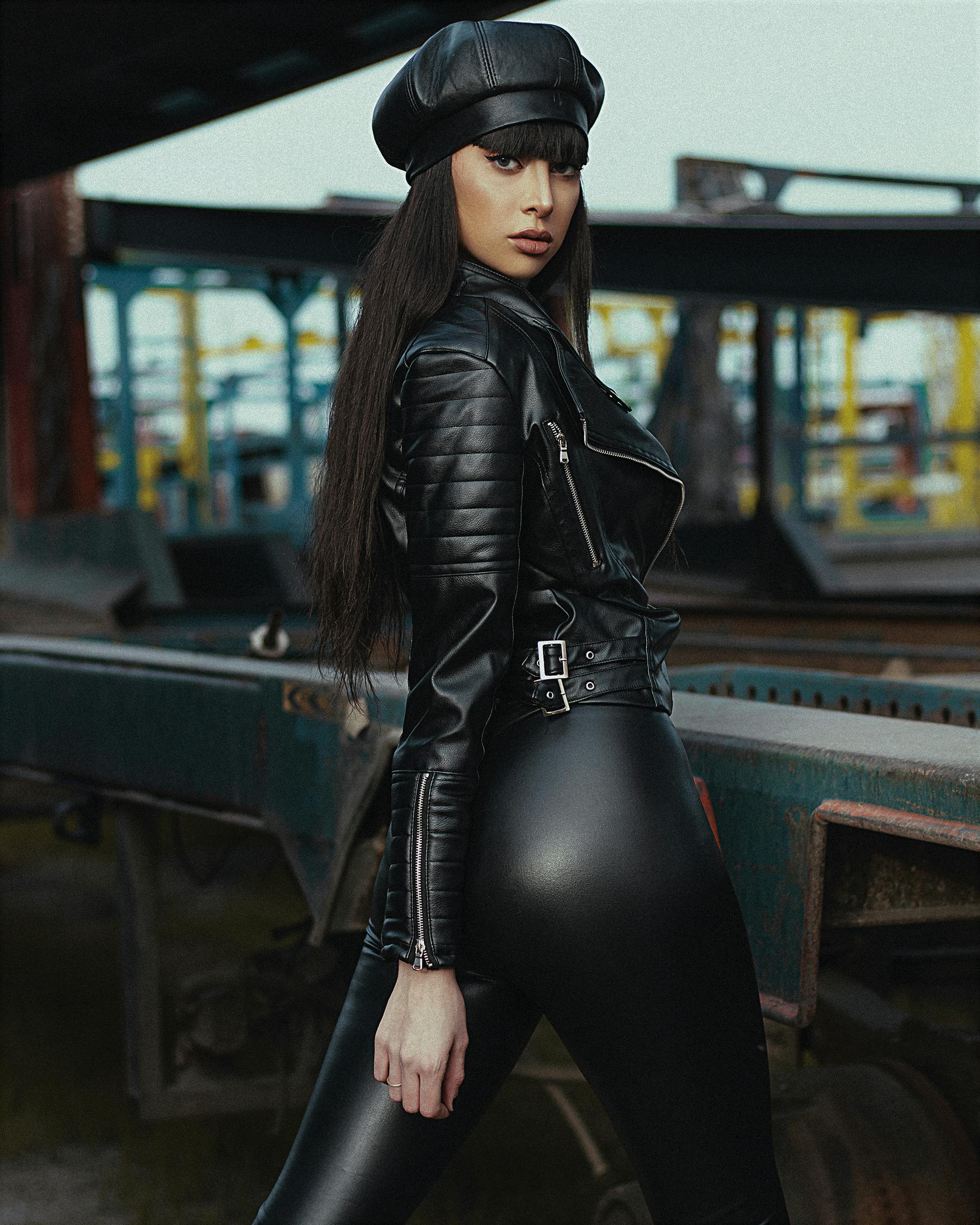 Beautiful Girl With Long Black Hair Wearing Dark Jacket, Leather Hot Pants  Und Patterned Pantyhose And Showing Her Back. Stock Photo, Picture and  Royalty Free Image. Image 58639693.