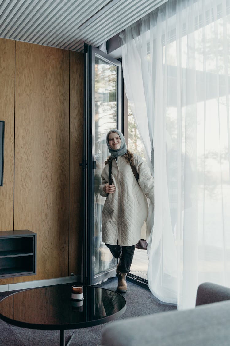 Photograph Of A Woman Entering A Room