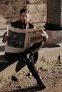 A Man in Brown Coat Reading a Newspaper