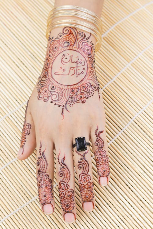 Close-Up Shot of a Hand with Mehndi Tattoo