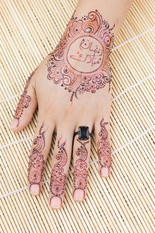 Close-Up Shot of a Hand with Mehndi Tattoo