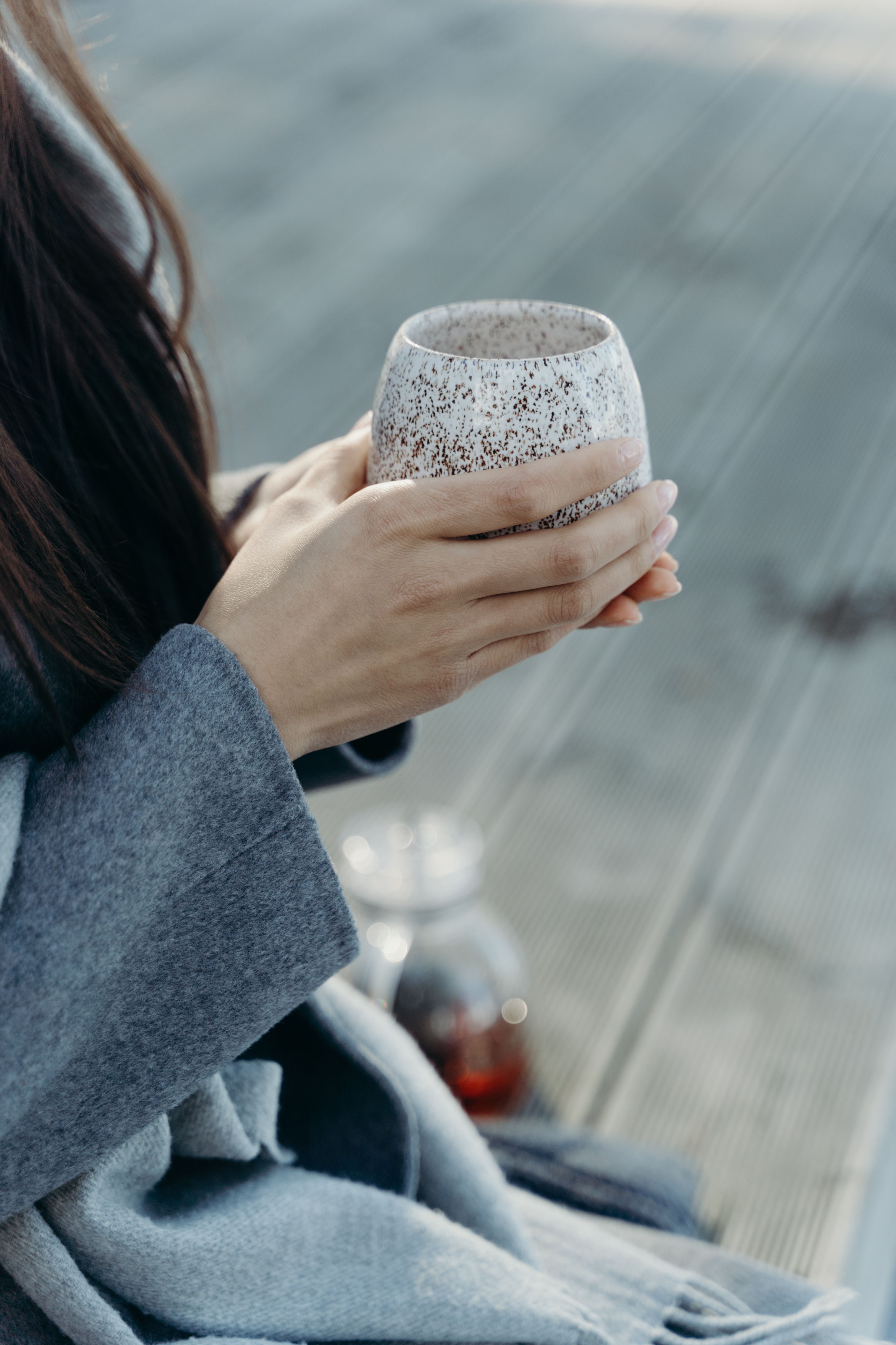 Person Holding a Cup in Close Up Photography · Free Stock Photo
