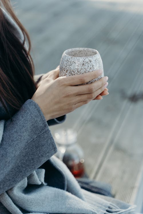 Free Person Holding a Cup in Close Up Photography Stock Photo