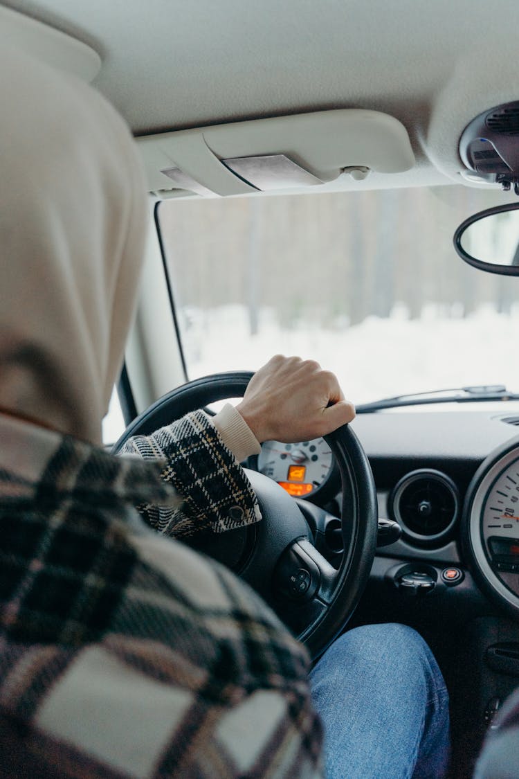 Man Driving A Car