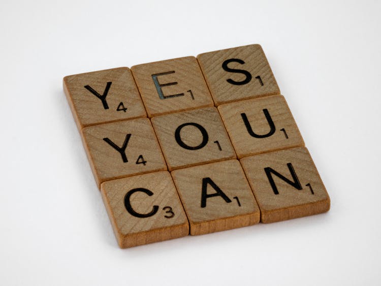 Close-Up Photo Of Yes You Can Text On White Surface