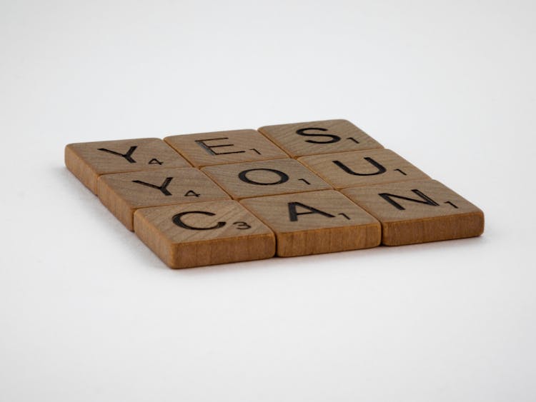 Close-Up Photo Of Yes You Can Text On White Surface