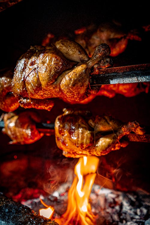 Free Close Up Shot of Roasted Chickens in the Rotisserie Stock Photo