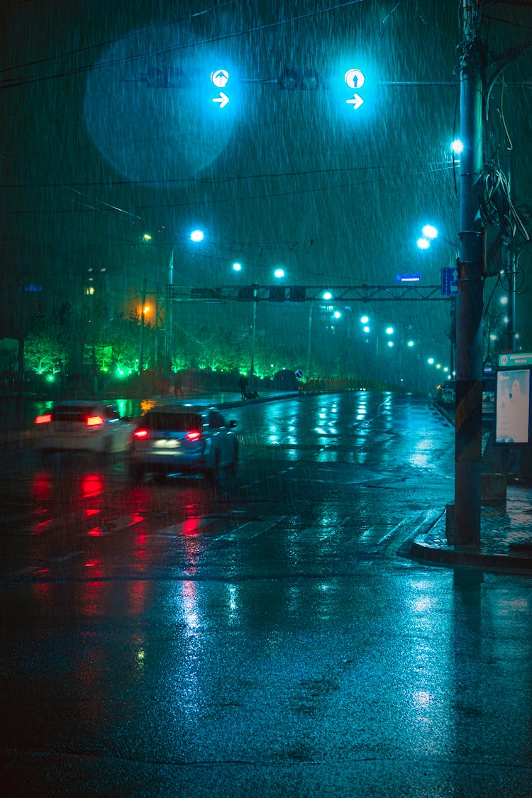 Cars Driving On Road During Night Time