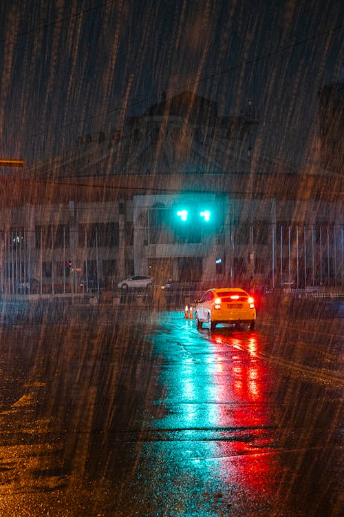 Orange Car on Road during Night Time