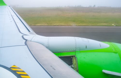 Green and White Airplane Wing