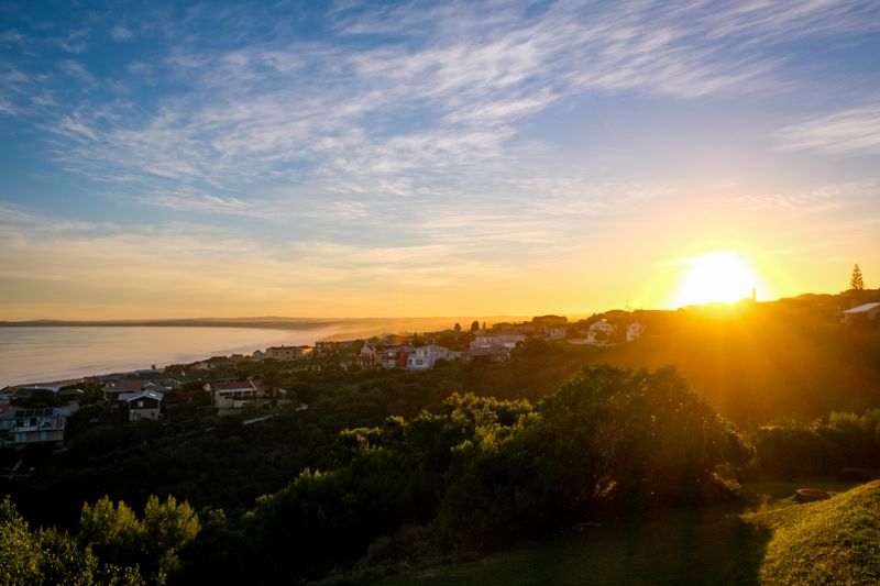 Sunset over a hillside coastal town — Magda Ehlers on Pexels
