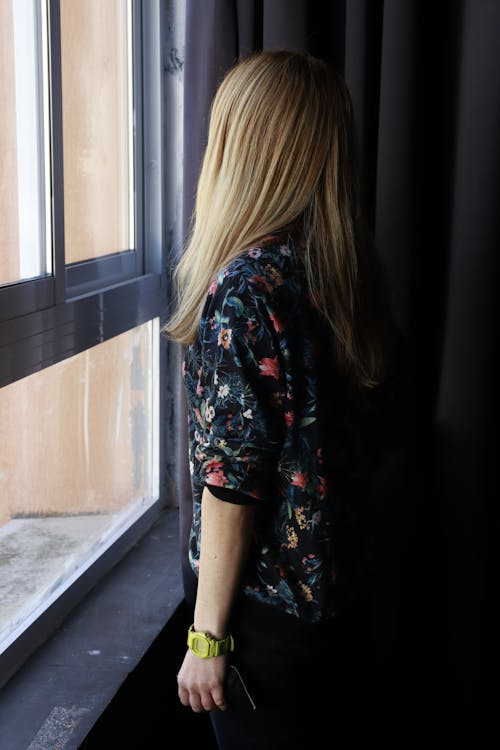 A Woman Looking Out the Window