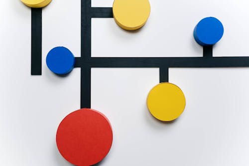 Colorful Circles Connected with Black Lines on White Background 