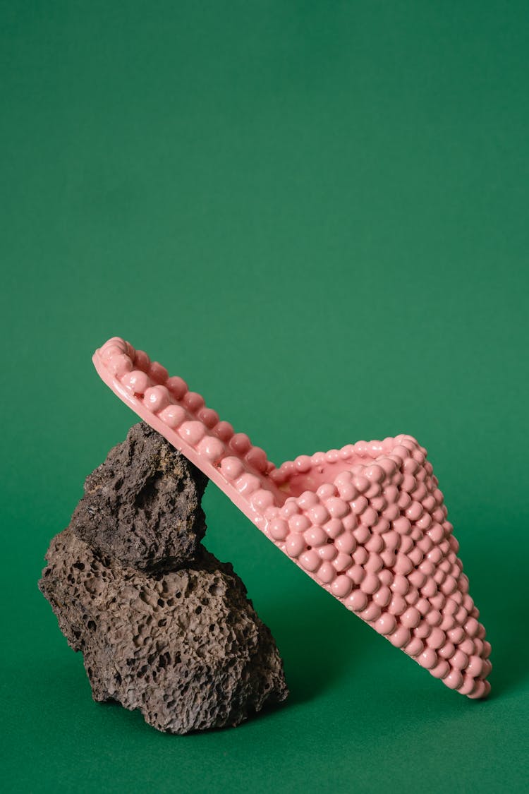 Pink Beaded Slippers On A Stone