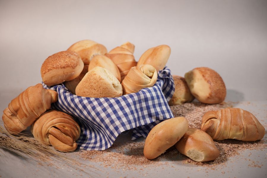 Fresh bread buns in a wicker bowl at the Saltbrook counter