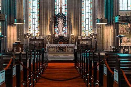 Brown Wooden Benches Inside the Cathedral