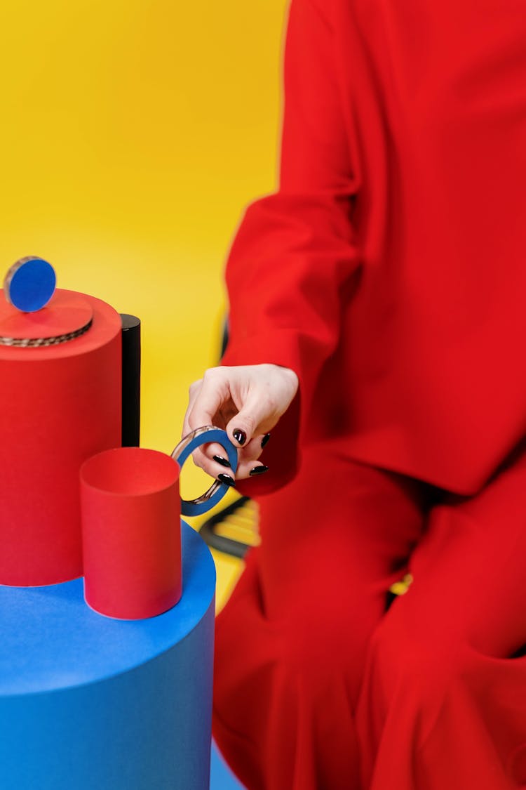 Person Holding Red Mug