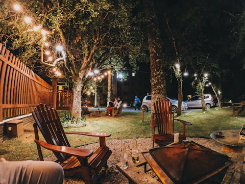 Wooden table with chairs around fireplace