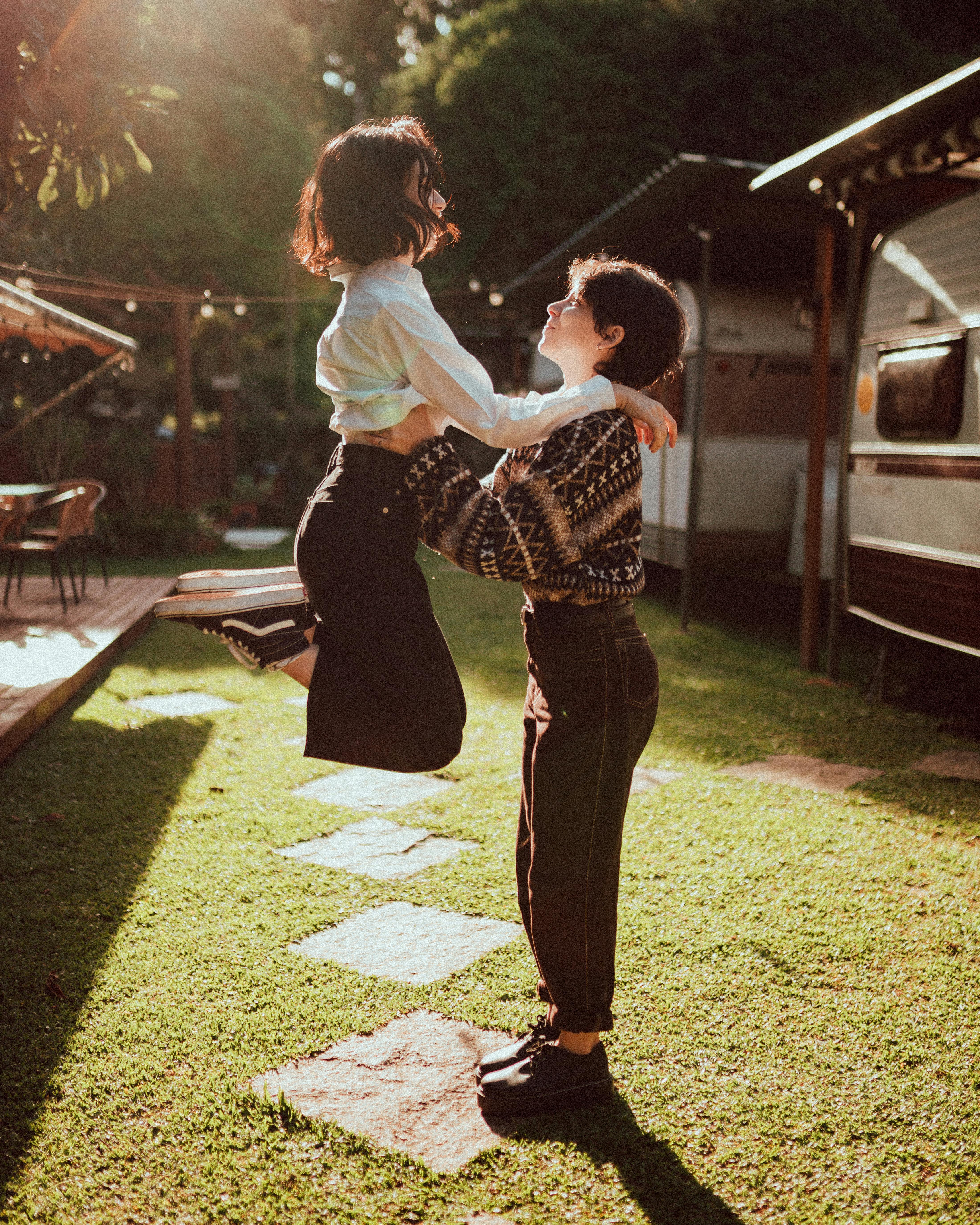 delighted young female best friends having fun in nature