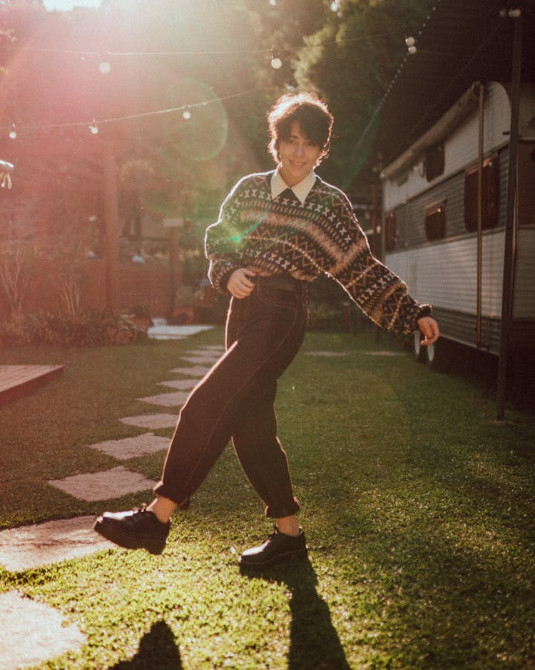 Smiling Woman Doing Kick In Backyard