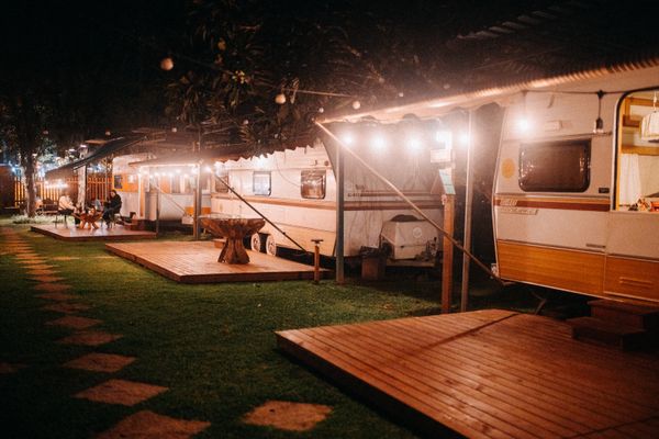 Caravans and awnings on a campsite in the evening
