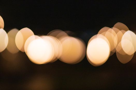 Abstract bokeh background of overlapped lights in evening
